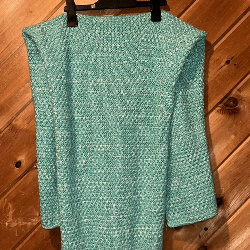 Handmade teal crocheted mermaid tail blanket